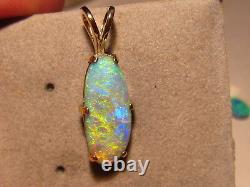 3.1 ct. Opal Pendant 14 kt yellow gold Lightning ridge crystal opal