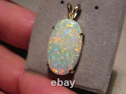 7.75 ct. Gem Opal Pendant solid 14 kt yellow gold Great color play