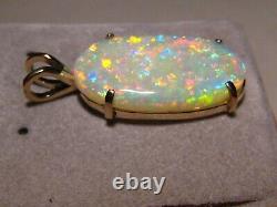 7.75 ct. Gem Opal Pendant solid 14 kt yellow gold Great color play